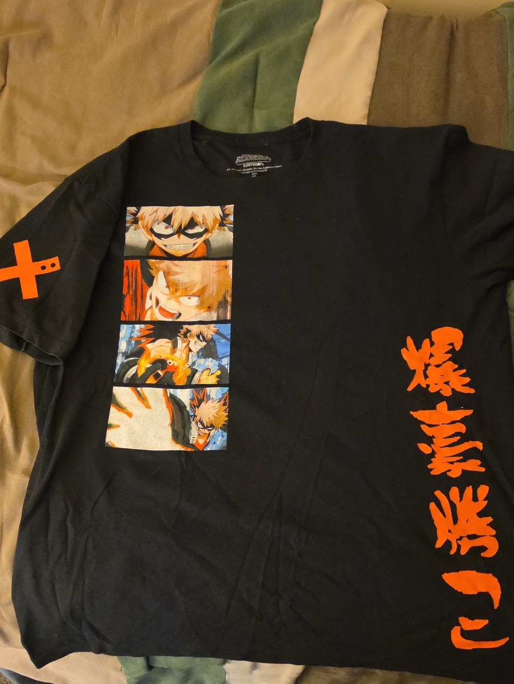 Black Anime Graphic Tee with Orange Kanji and Panel Art- Katsuki Bakugo